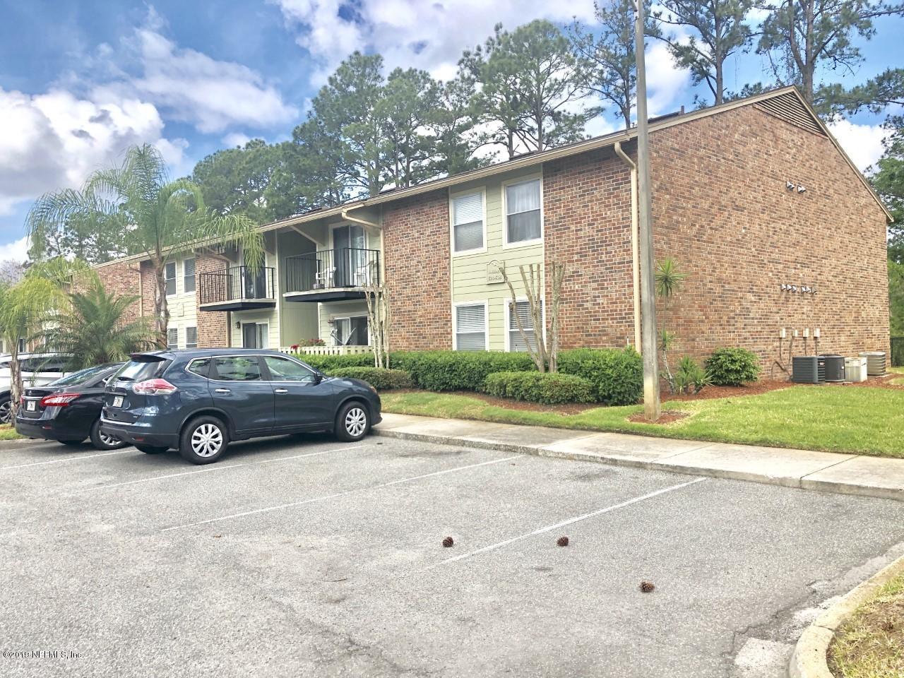 3737 Loretto Road, Unit 505 Jacksonville, FL 32223 - Photo 2 of 15 a view of a car parked in front of a house