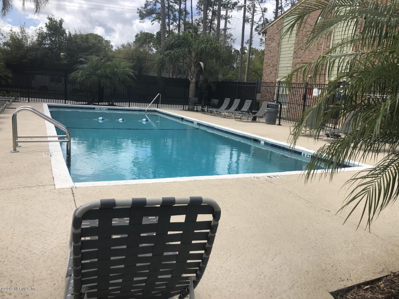 3737 Loretto Road, Unit 505 Jacksonville, FL 32223 - Photo 3 of 15 a view of a wooden floor with a yard