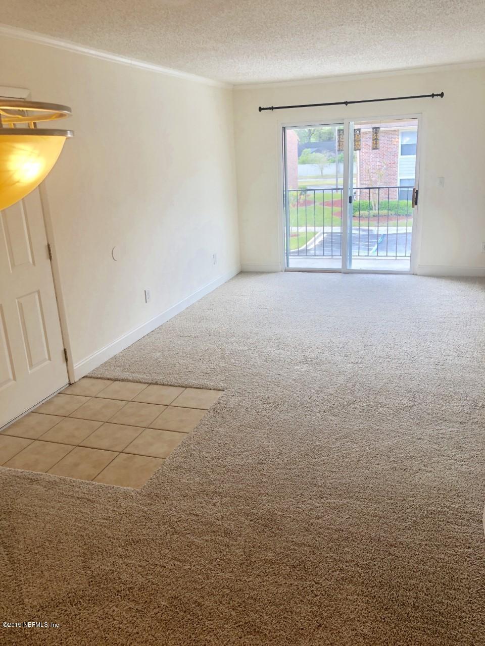 3737 Loretto Road, Unit 505 Jacksonville, FL 32223 - Photo 5 of 15 a view of an empty room with a window