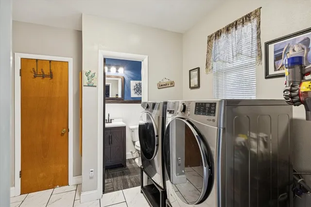a view of a kitchen with washer and dryer