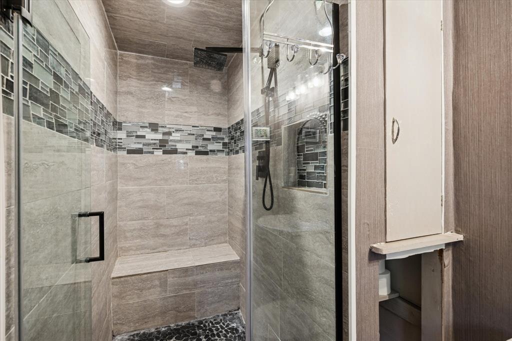 6001 Jacqueline Road Fort Worth, TX 76112 - Photo 22 of 26 a bathroom with a glass shower door