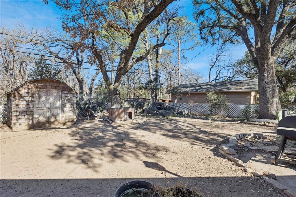 6001 Jacqueline Road Fort Worth, TX 76112 - Photo 26 of 26 a view of a backyard with large trees