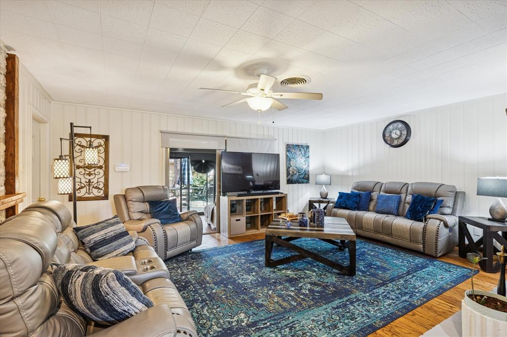 6001 Jacqueline Road Fort Worth, TX 76112 - Photo 8 of 26 a living room with furniture and a rug