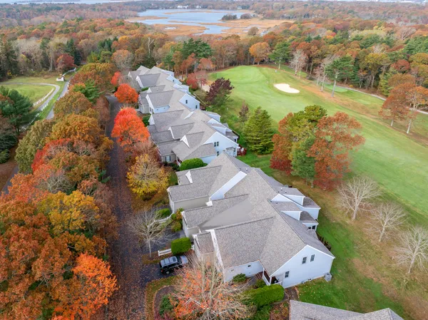 an aerial view of residential houses with outdoor space