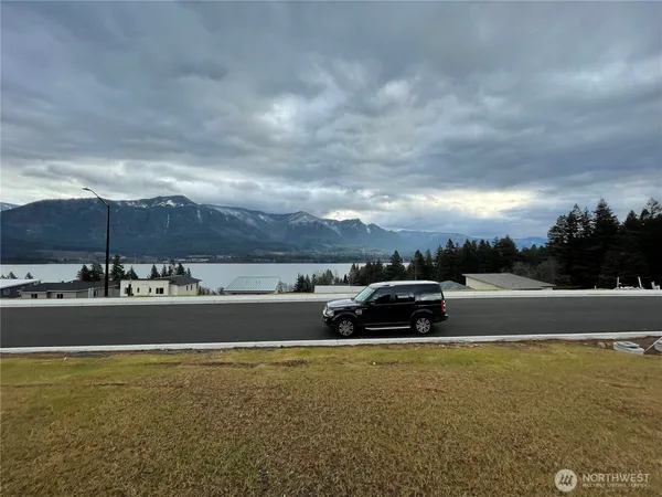 a view of a swimming pool and an outdoor seating