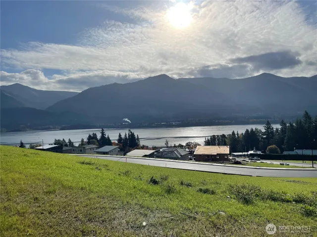 a view of a big yard with table and chairs