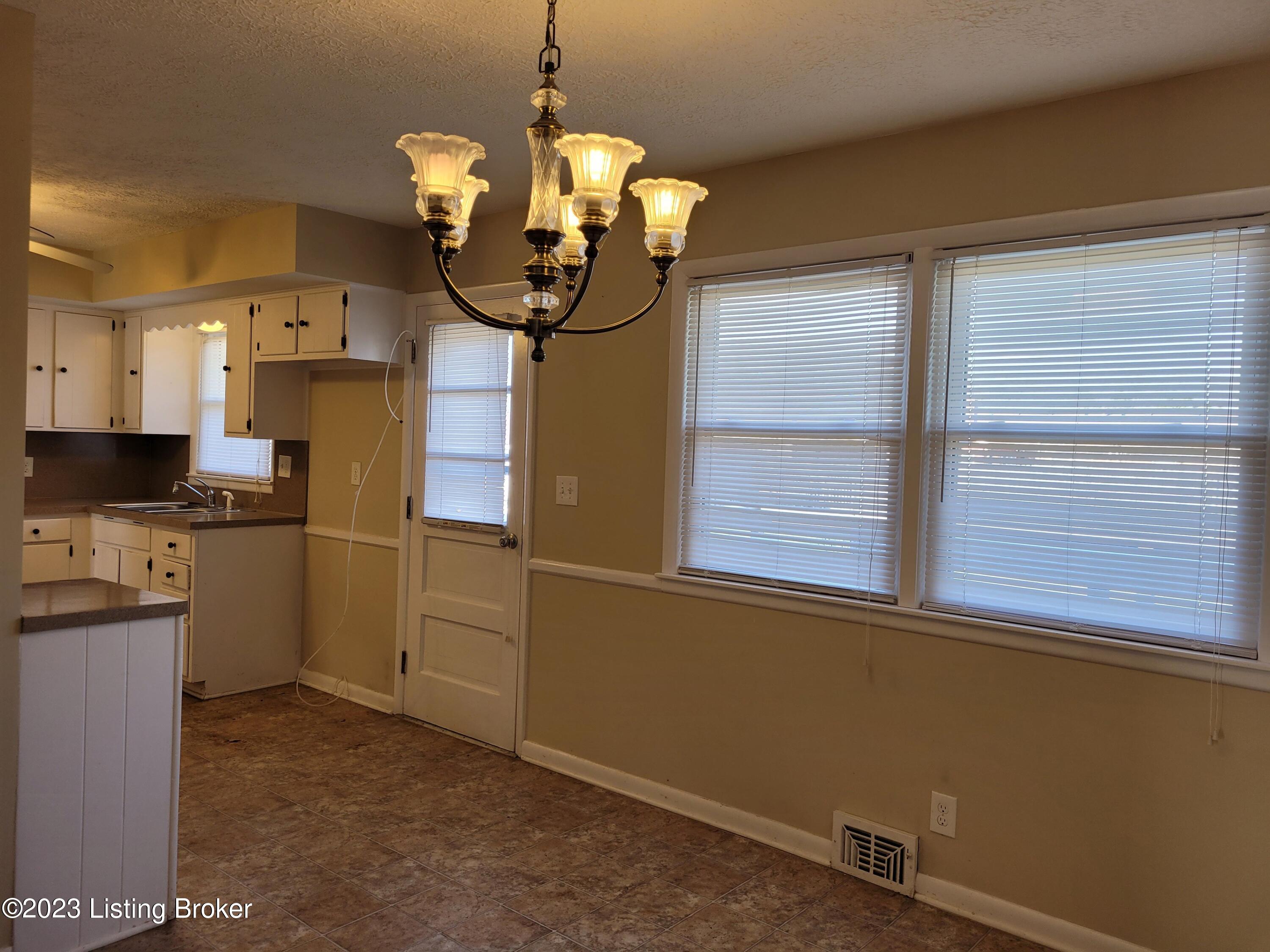 6703 Watch Hill Road Louisville, KY 40228 - Photo 6 of 23 Dining area looking to rear door