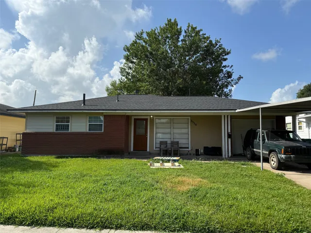 a house view with a garden space