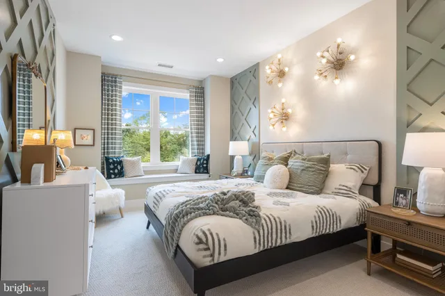 a spacious bedroom with a large bed and a large window