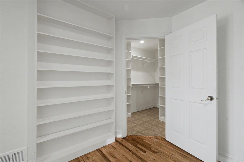 1714 East Union Bower Road Irving, TX 75061 - Photo 23 of 32 a view of walk in closet with empty racks