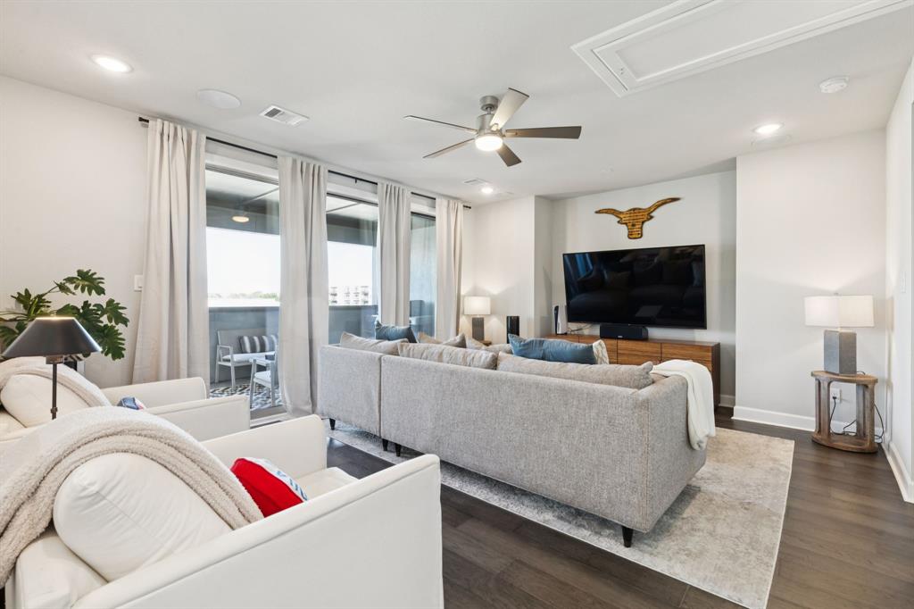 7121 Laurel Ridge Dallas, TX 75231 - Photo 17 of 25 a living room with furniture and a flat screen tv