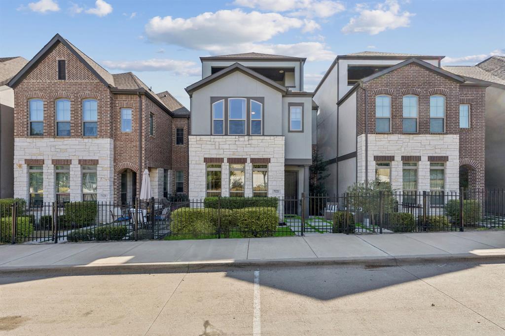 7121 Laurel Ridge Dallas, TX 75231 - Photo 2 of 25 front view of a brick house with a yard