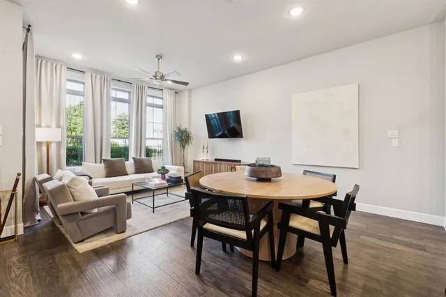 a view of a dining room with furniture window and wooden floor