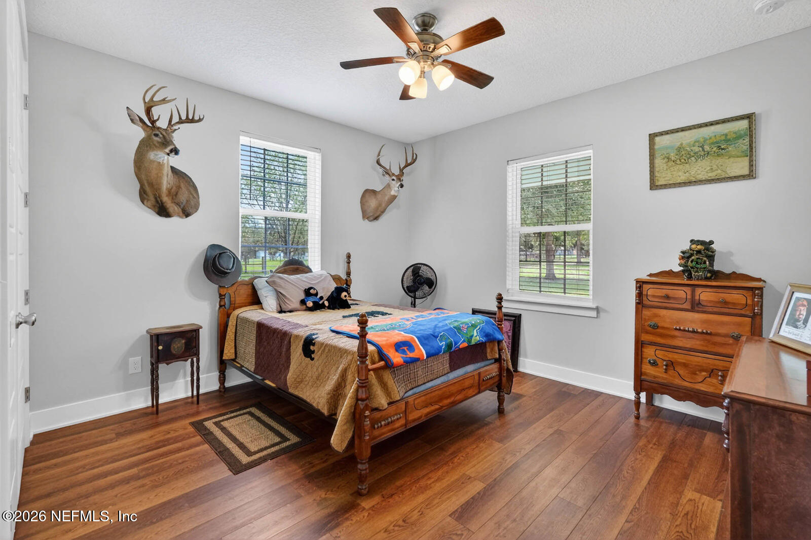 264 Peniel Church Road Palatka, FL 32177 - Photo 26 of 48 a bedroom with a bed and wooden floor