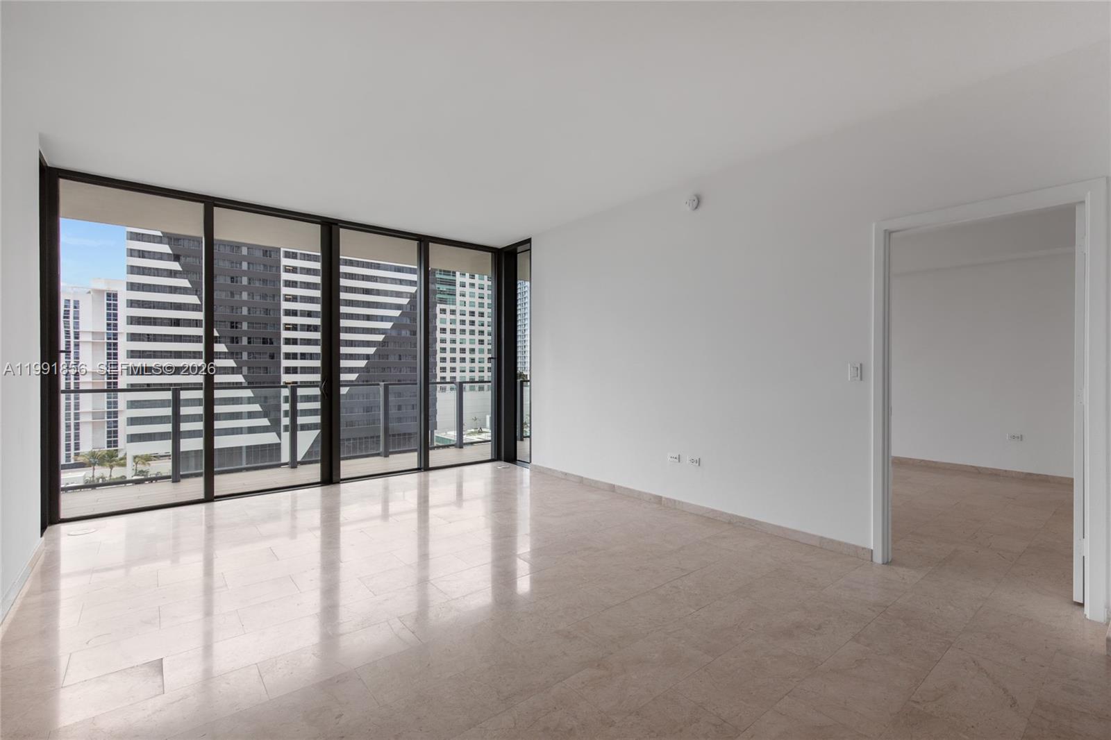 88 Southwest 7th Street, Unit 904 Miami, FL 33130 - Photo 13 of 26 a view of an empty room with a window