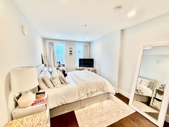 366 Hanover Street, Unit 4 Boston, MA 02113 - Photo 13 of 14 a bedroom with a bed and wooden floor