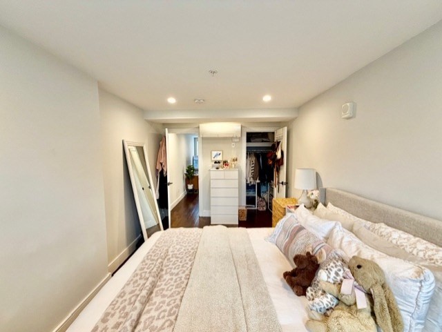 366 Hanover Street, Unit 4 Boston, MA 02113 - Photo 14 of 14 a bedroom with a bed a mirror and a desk