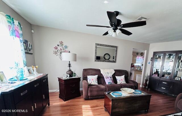130 Courtshire Drive Brick, NJ 08723 - Photo 11 of 27 a living room with furniture and a wooden floor