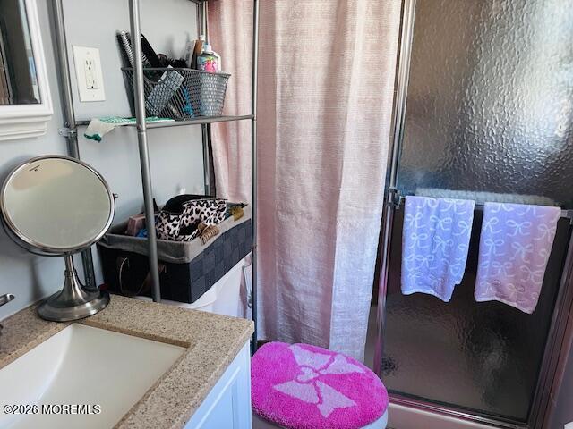 130 Courtshire Drive Brick, NJ 08723 - Photo 13 of 27 a bathroom with a granite countertop sink and a mirror