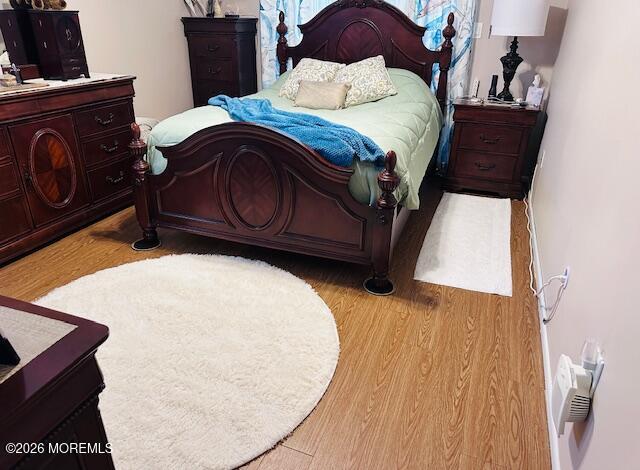 130 Courtshire Drive Brick, NJ 08723 - Photo 14 of 27 a bed sitting in a bedroom next to a window