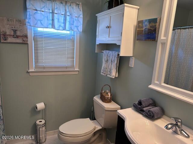 130 Courtshire Drive Brick, NJ 08723 - Photo 16 of 27 a white toilet sitting next to a bathroom sink