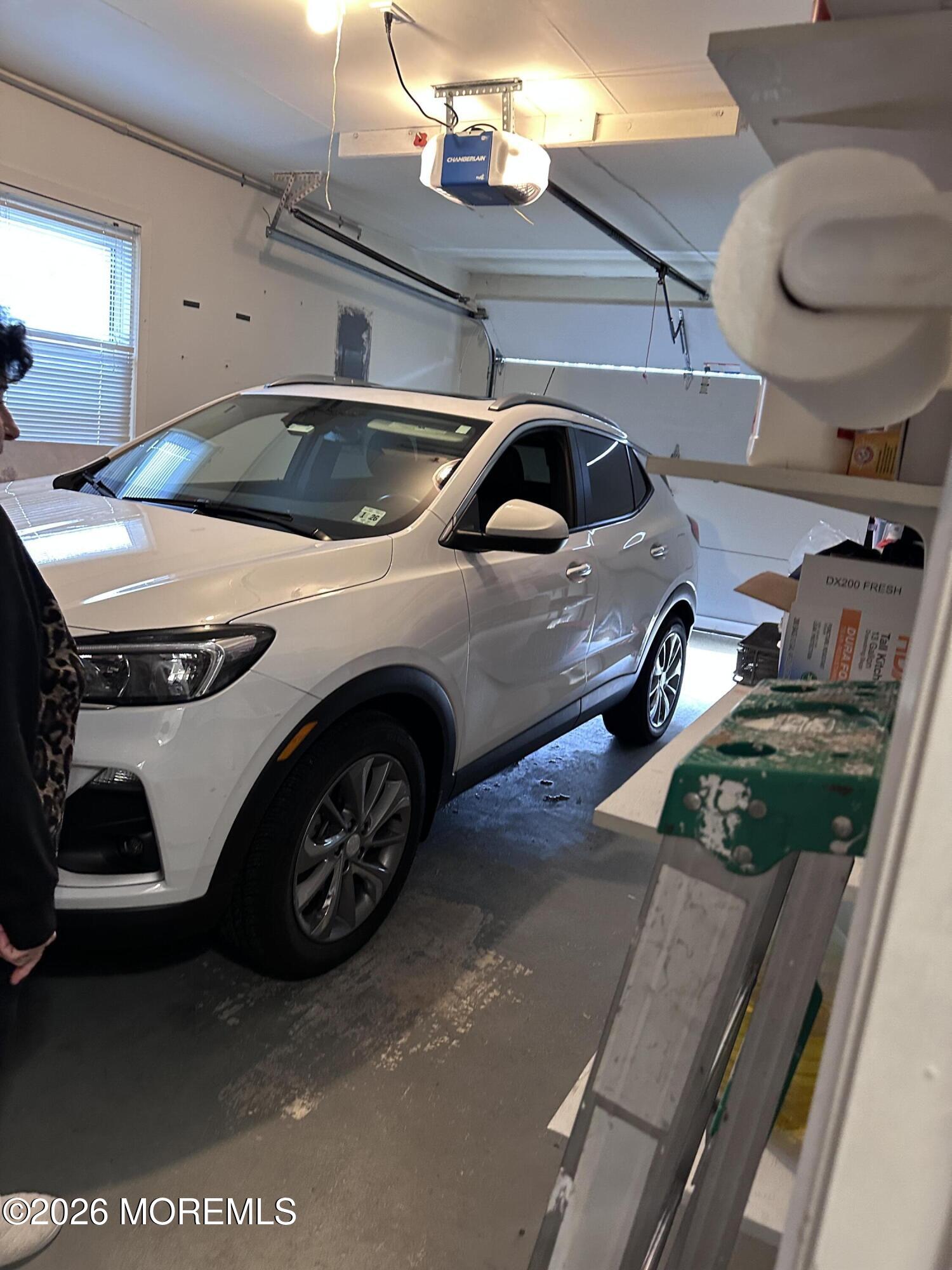 130 Courtshire Drive Brick, NJ 08723 - Photo 17 of 27 a car parked in garage