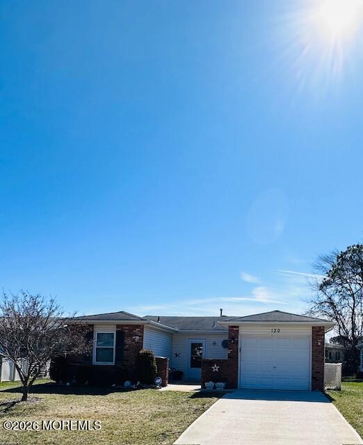 130 Courtshire Drive Brick, NJ 08723 - Photo 2 of 27 a front view of a house with a yard