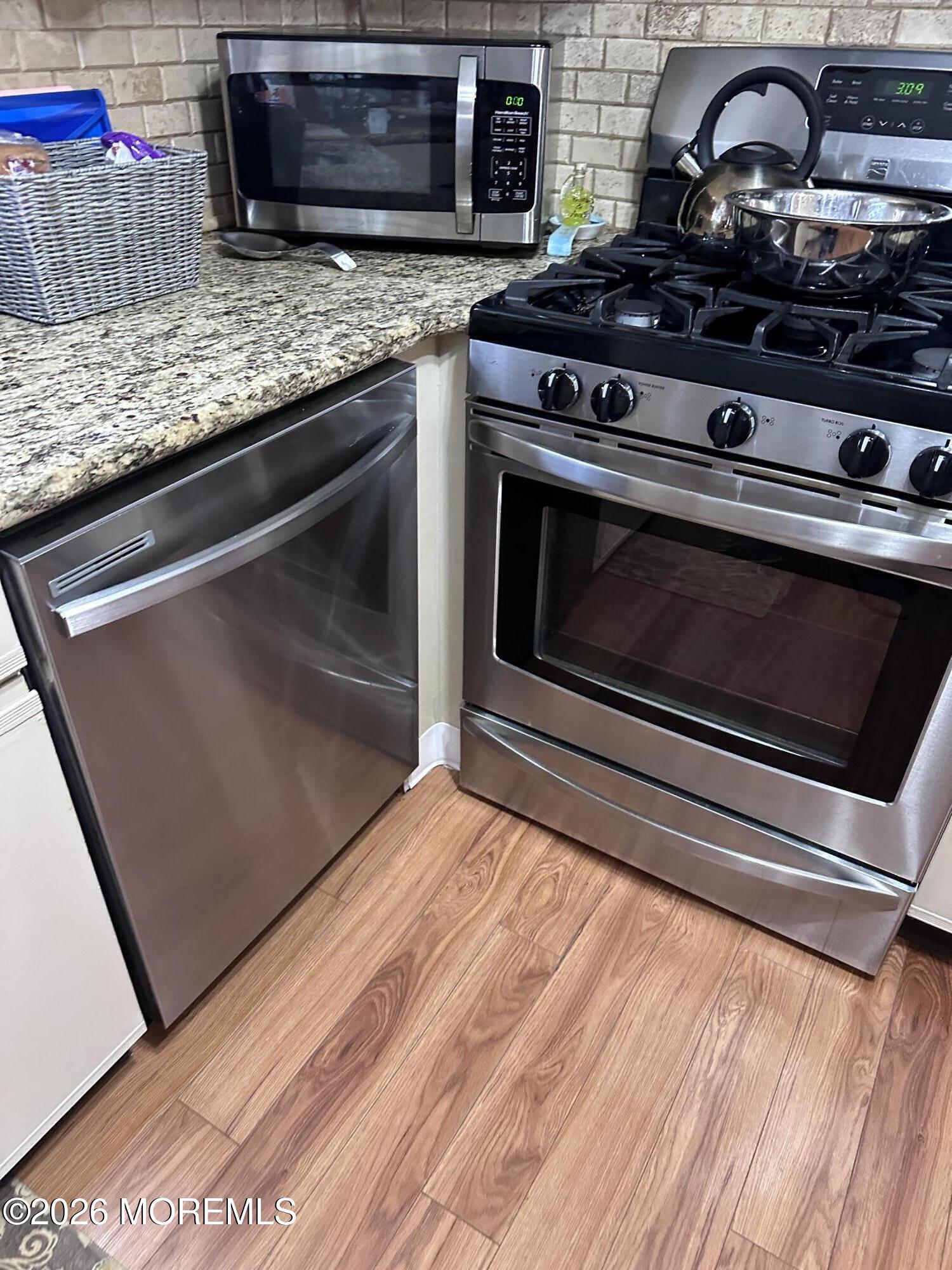 130 Courtshire Drive Brick, NJ 08723 - Photo 7 of 27 a stove top oven sitting inside of a kitchen
