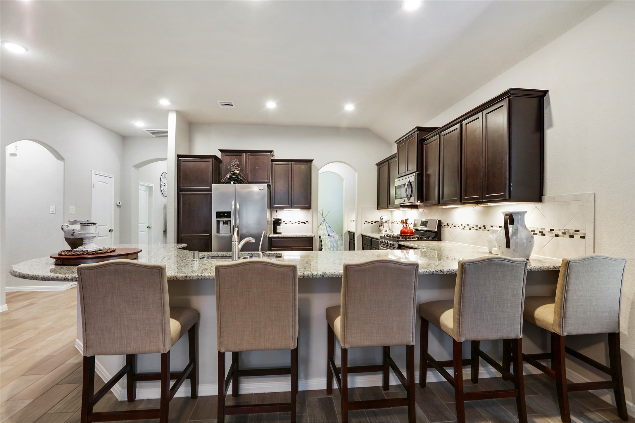 14141 Isle Royal Lane Conroe, TX 77384 - Photo 17 of 39 a view of kitchen with granite countertop cabinets table and chairs
