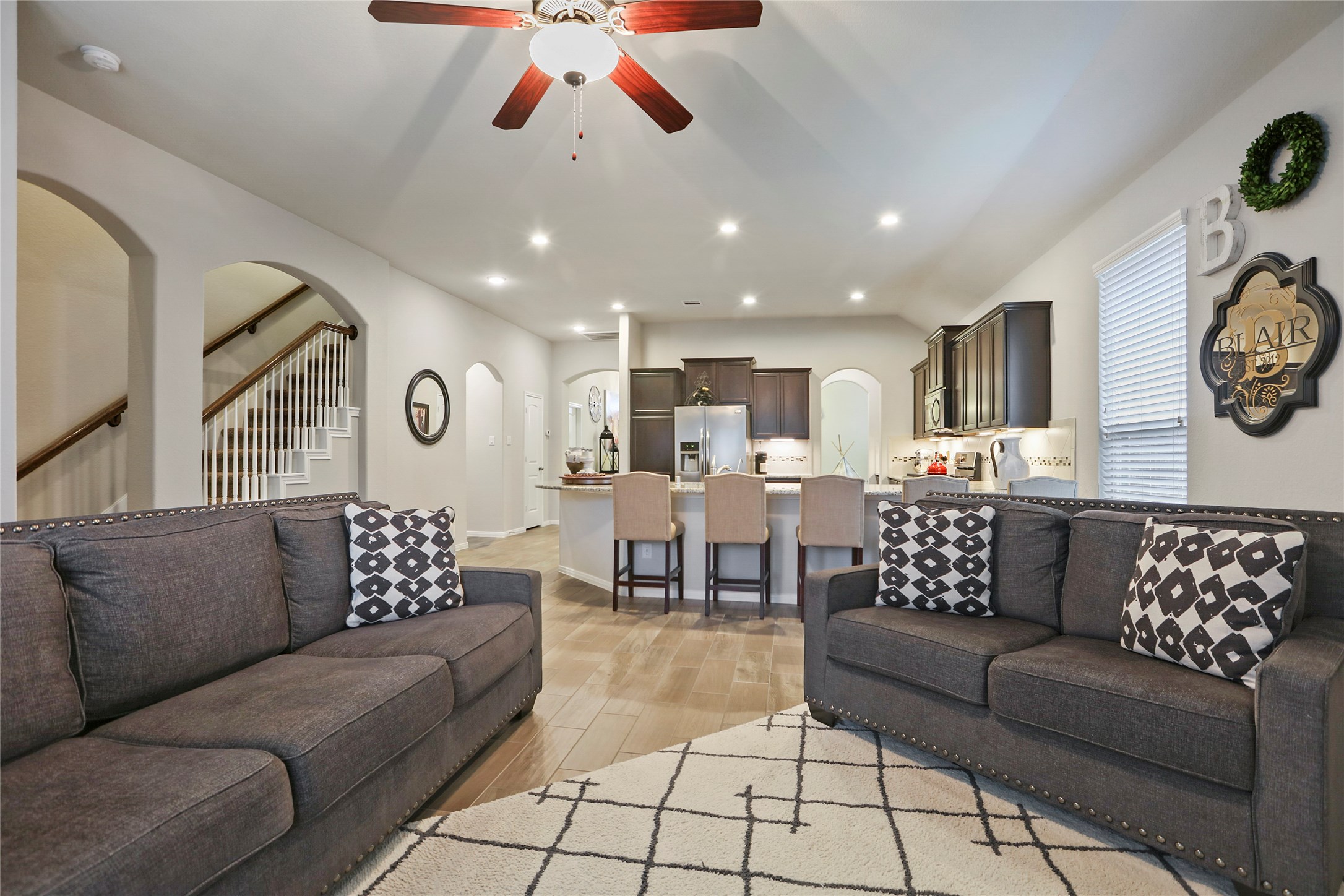 14141 Isle Royal Lane Conroe, TX 77384 - Photo 21 of 39 a living room with furniture and kitchen view