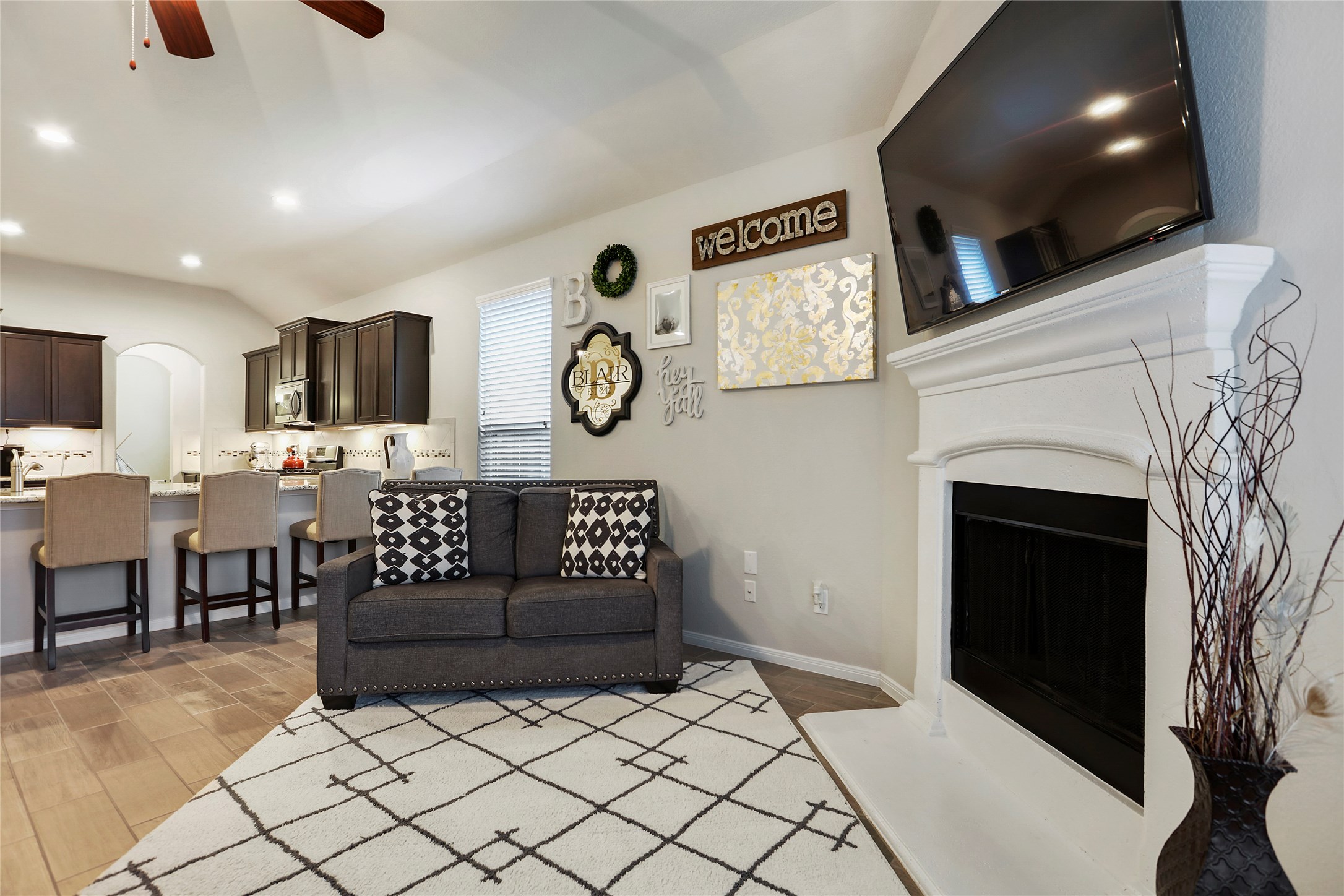 14141 Isle Royal Lane Conroe, TX 77384 - Photo 22 of 39 a living room with furniture and a flat screen tv