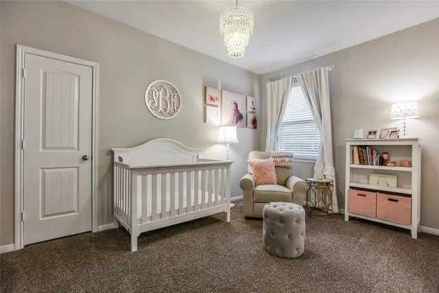 a bedroom with furniture and a window