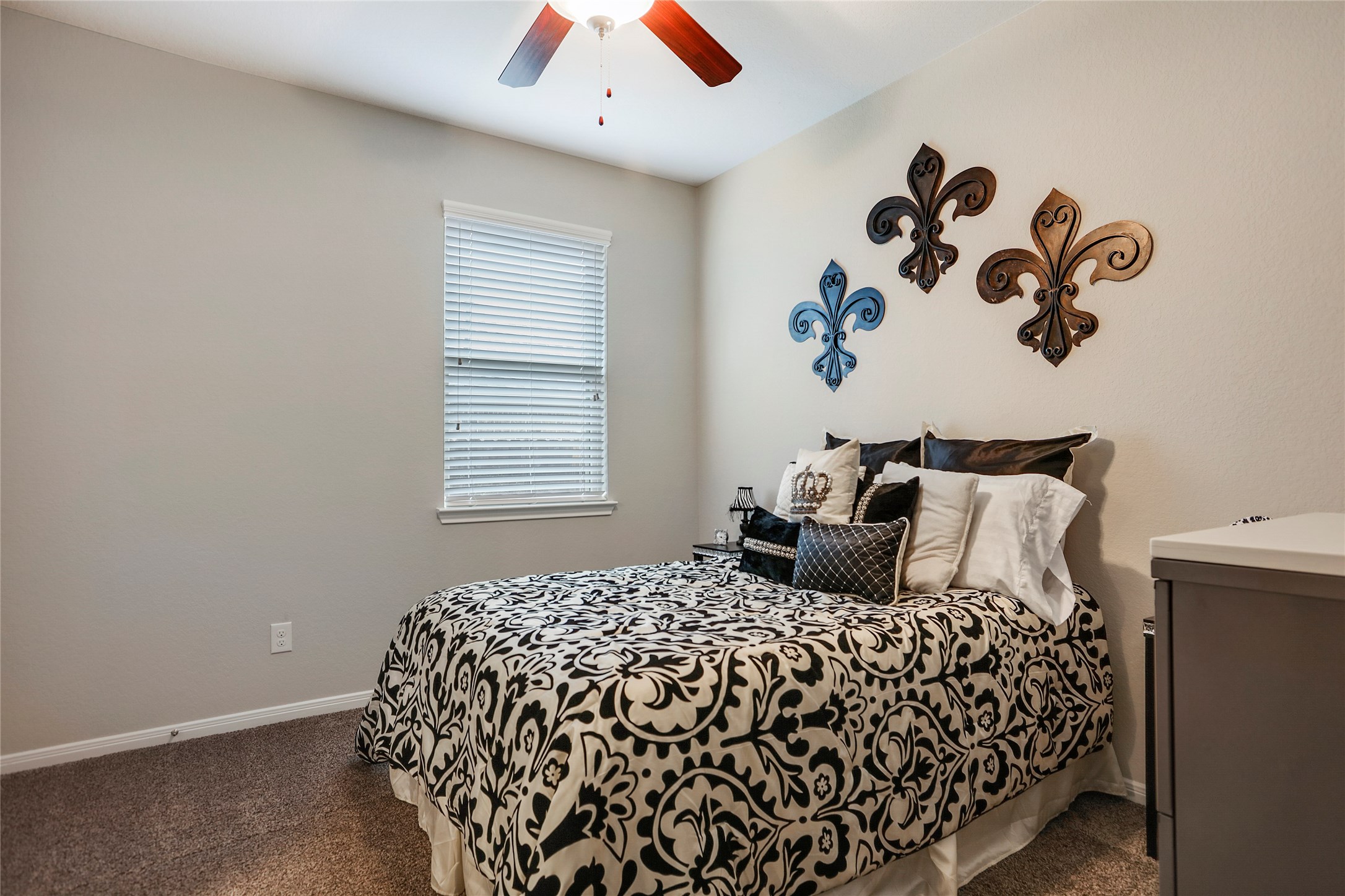 14141 Isle Royal Lane Conroe, TX 77384 - Photo 29 of 39 a bedroom with a bed and a window