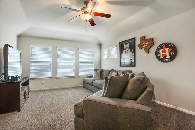 a living room with furniture and a window
