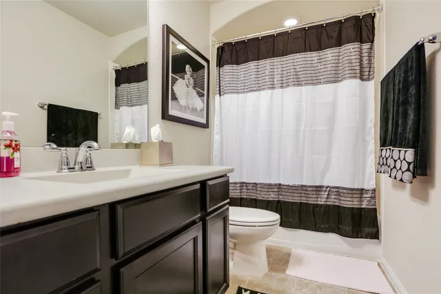a view of a patio with couches table and chairs and potted plants
