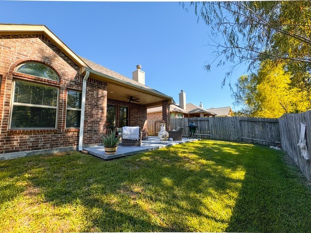 14141 Isle Royal Lane Conroe, TX 77384 - Photo 37 of 39 a view of a house with backyard porch and sitting area