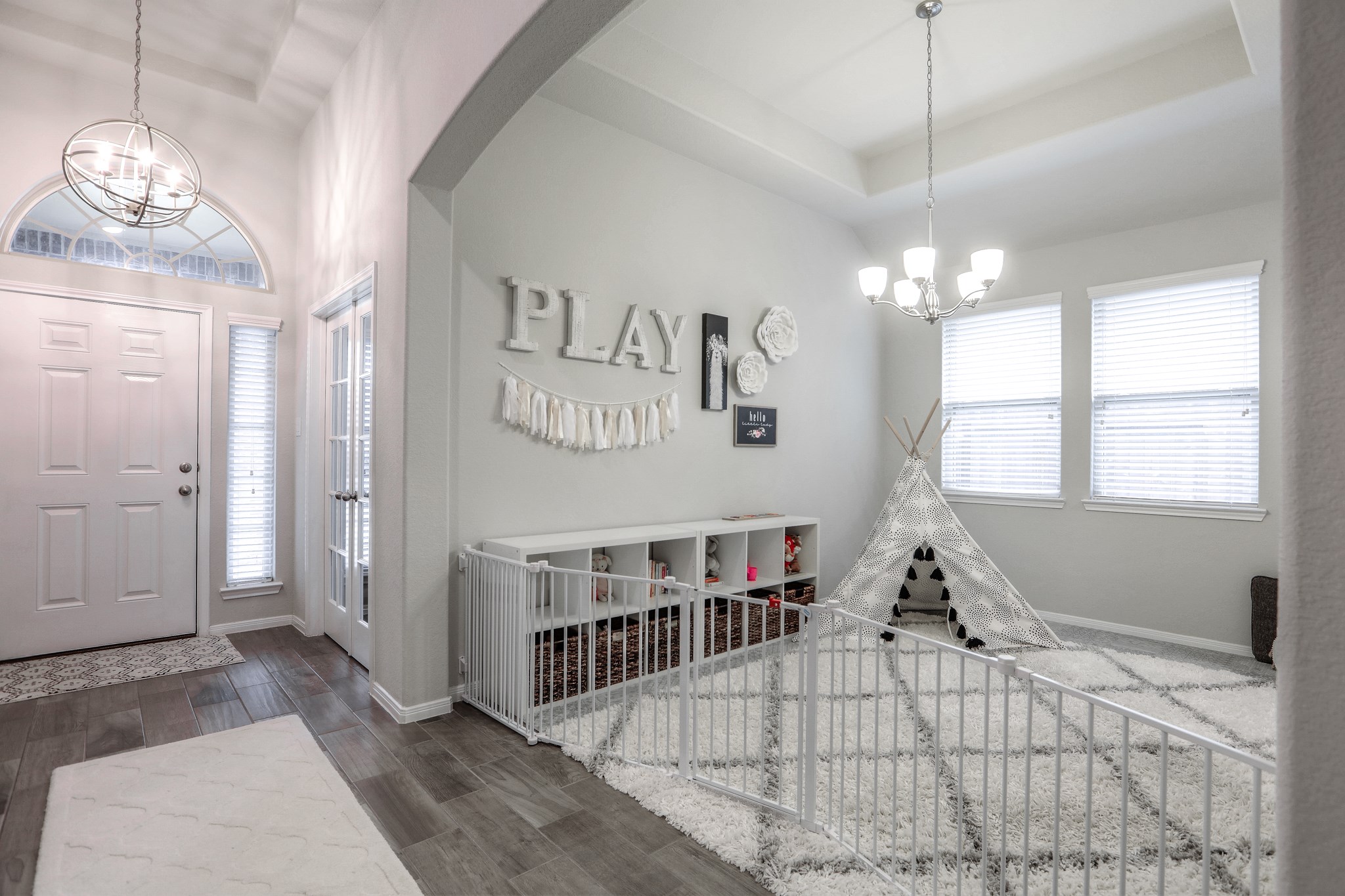 14141 Isle Royal Lane Conroe, TX 77384 - Photo 7 of 39 a bedroom with furniture and a chandelier