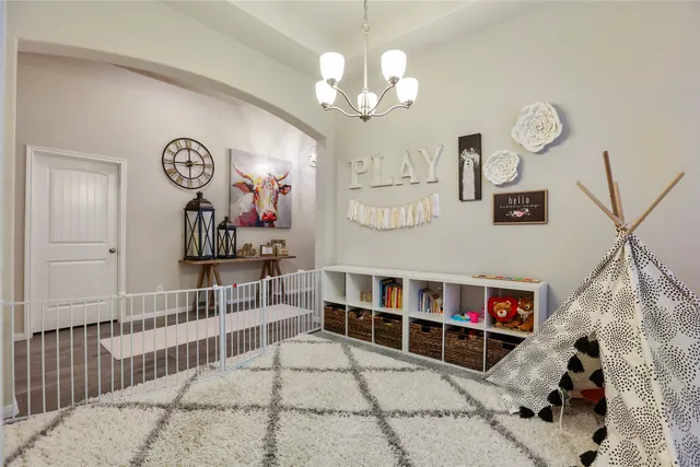 a view of a hallway with entryway wooden floor and front door