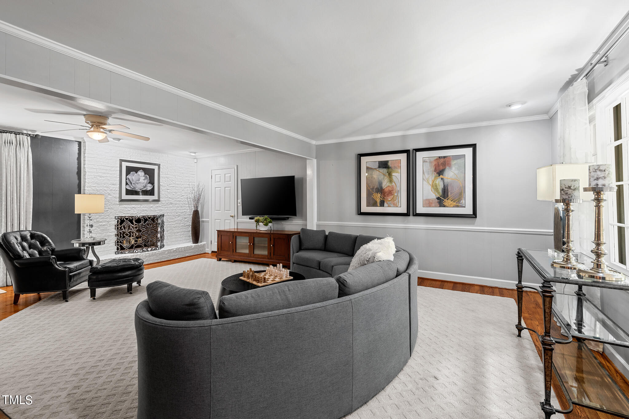 3404 Oates Drive Raleigh, NC 27604 - Photo 12 of 43 a living room with furniture and a flat screen tv