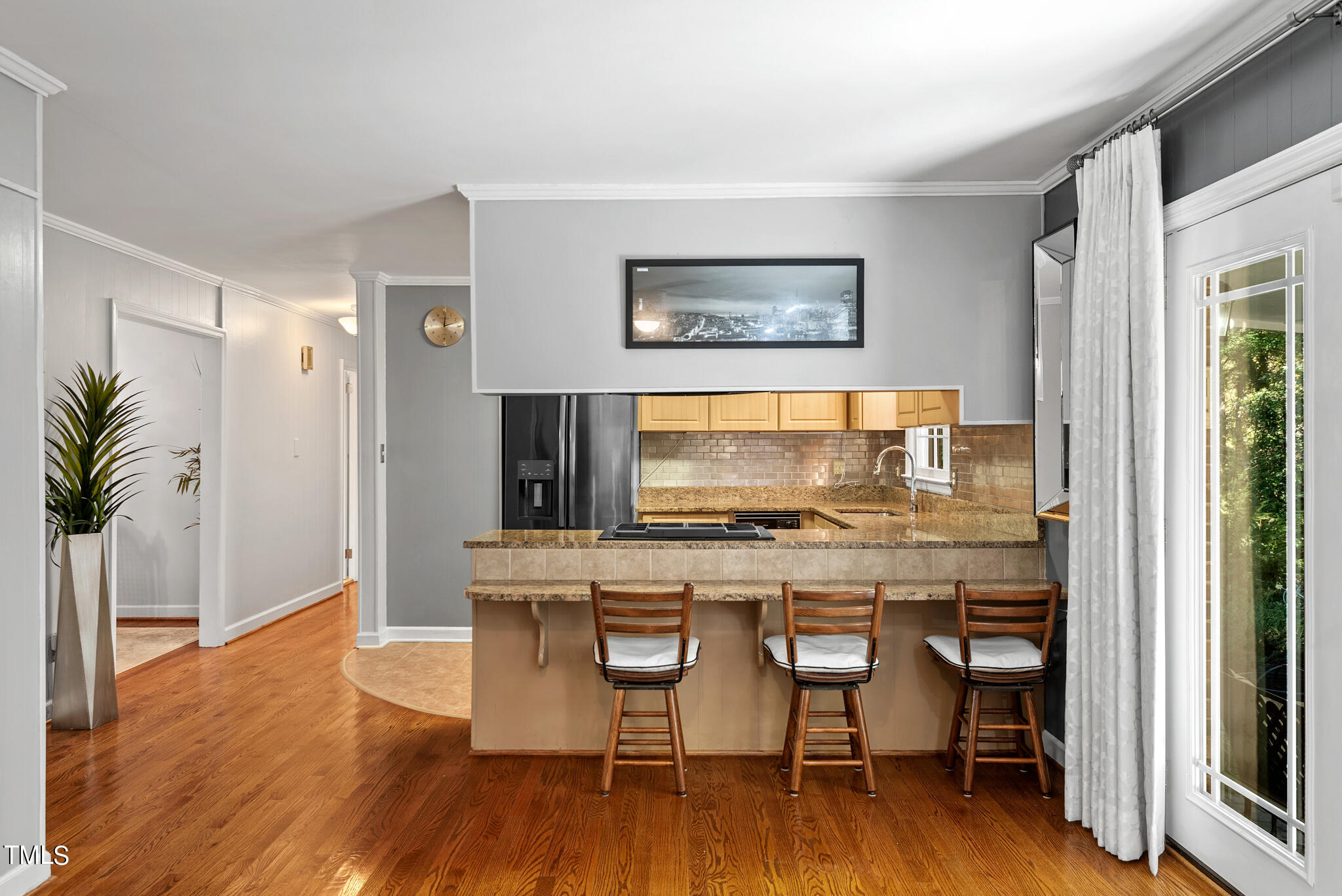 3404 Oates Drive Raleigh, NC 27604 - Photo 13 of 43 a view of a dining room with furniture and wooden floor