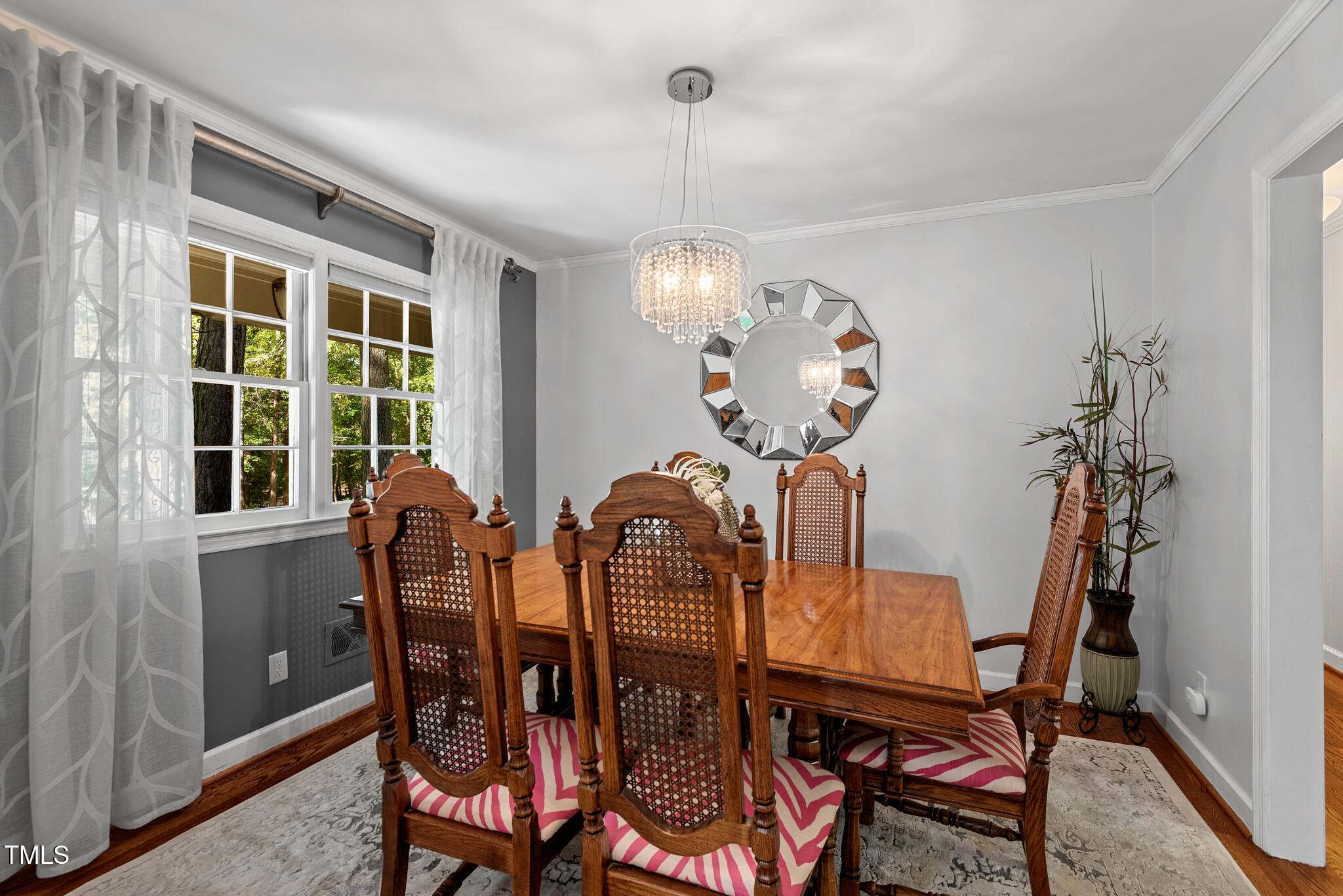 3404 Oates Drive Raleigh, NC 27604 - Photo 17 of 43 a view of a dining room with furniture and chandelier