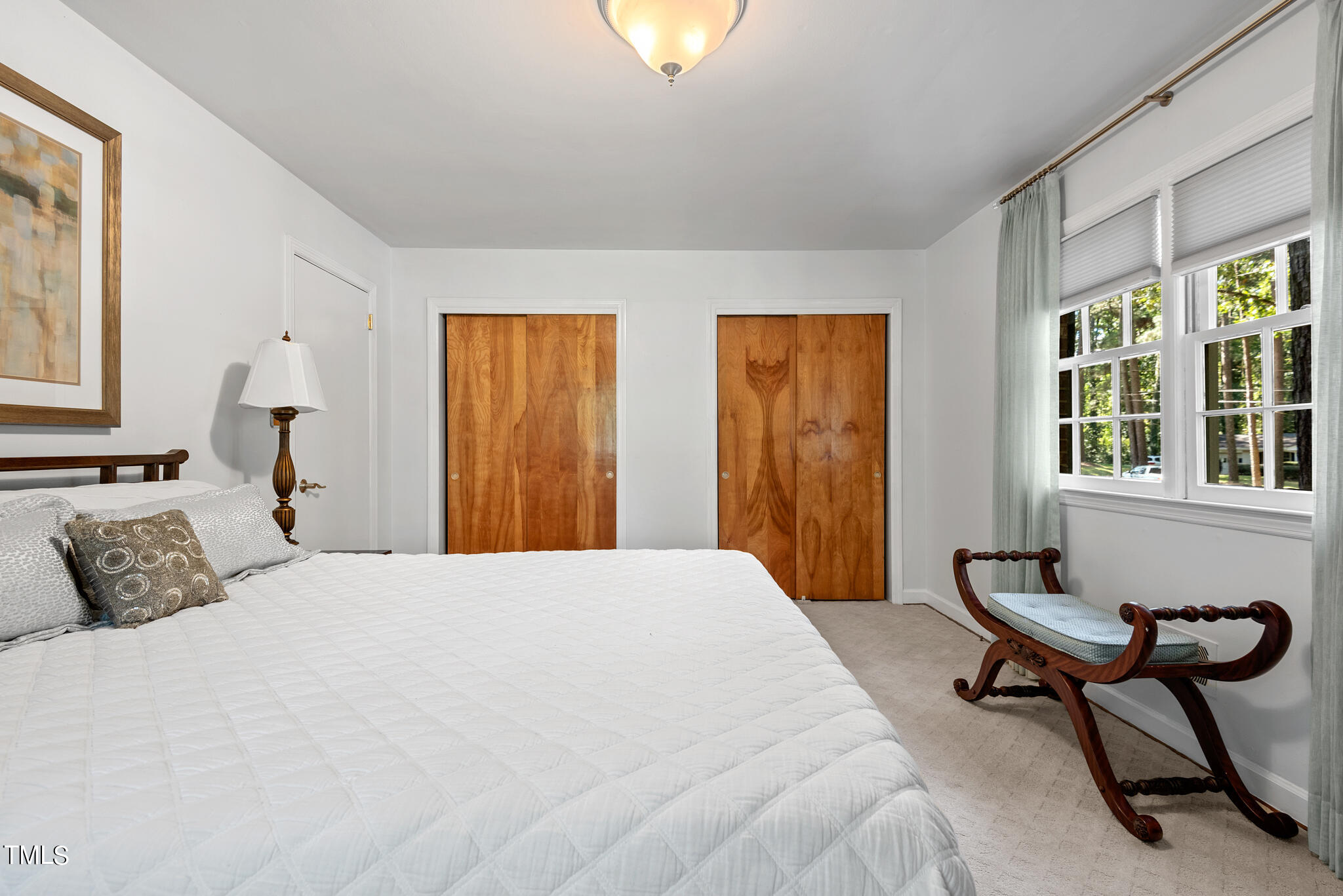 3404 Oates Drive Raleigh, NC 27604 - Photo 19 of 43 a bedroom with a bed and a window