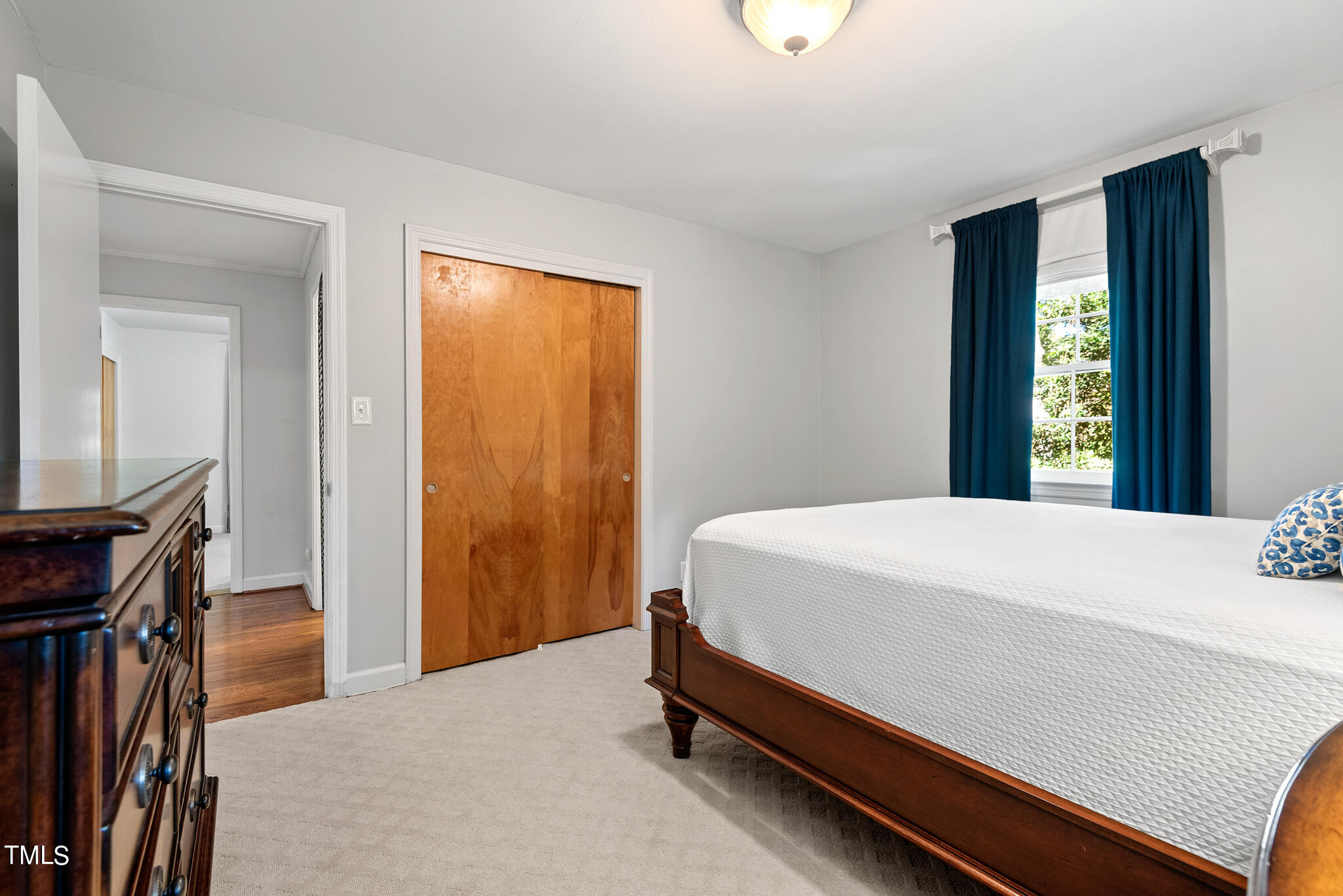 3404 Oates Drive Raleigh, NC 27604 - Photo 23 of 43 a bed sitting in a bedroom next to a window