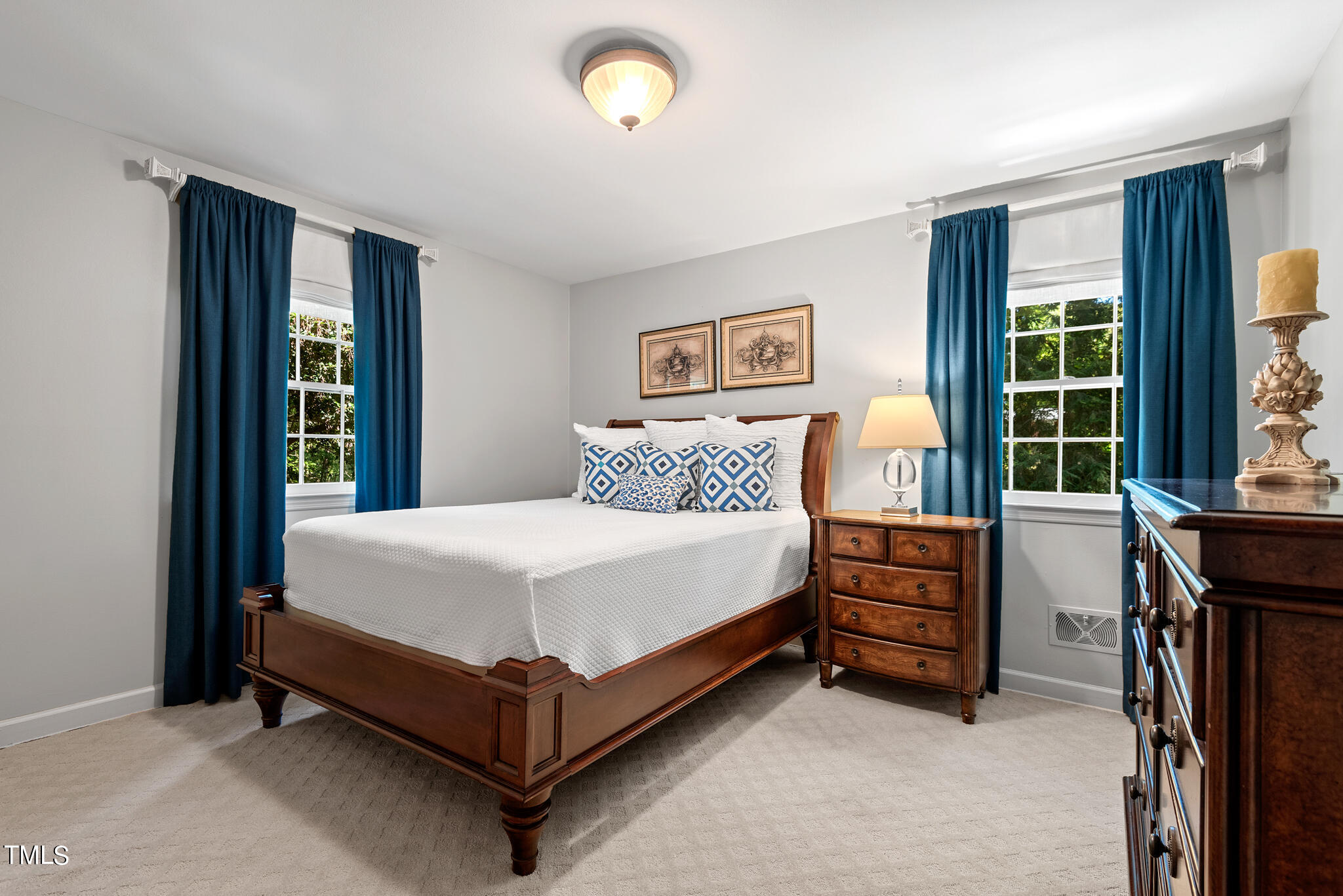 3404 Oates Drive Raleigh, NC 27604 - Photo 24 of 43 a bedroom with a bed and a window