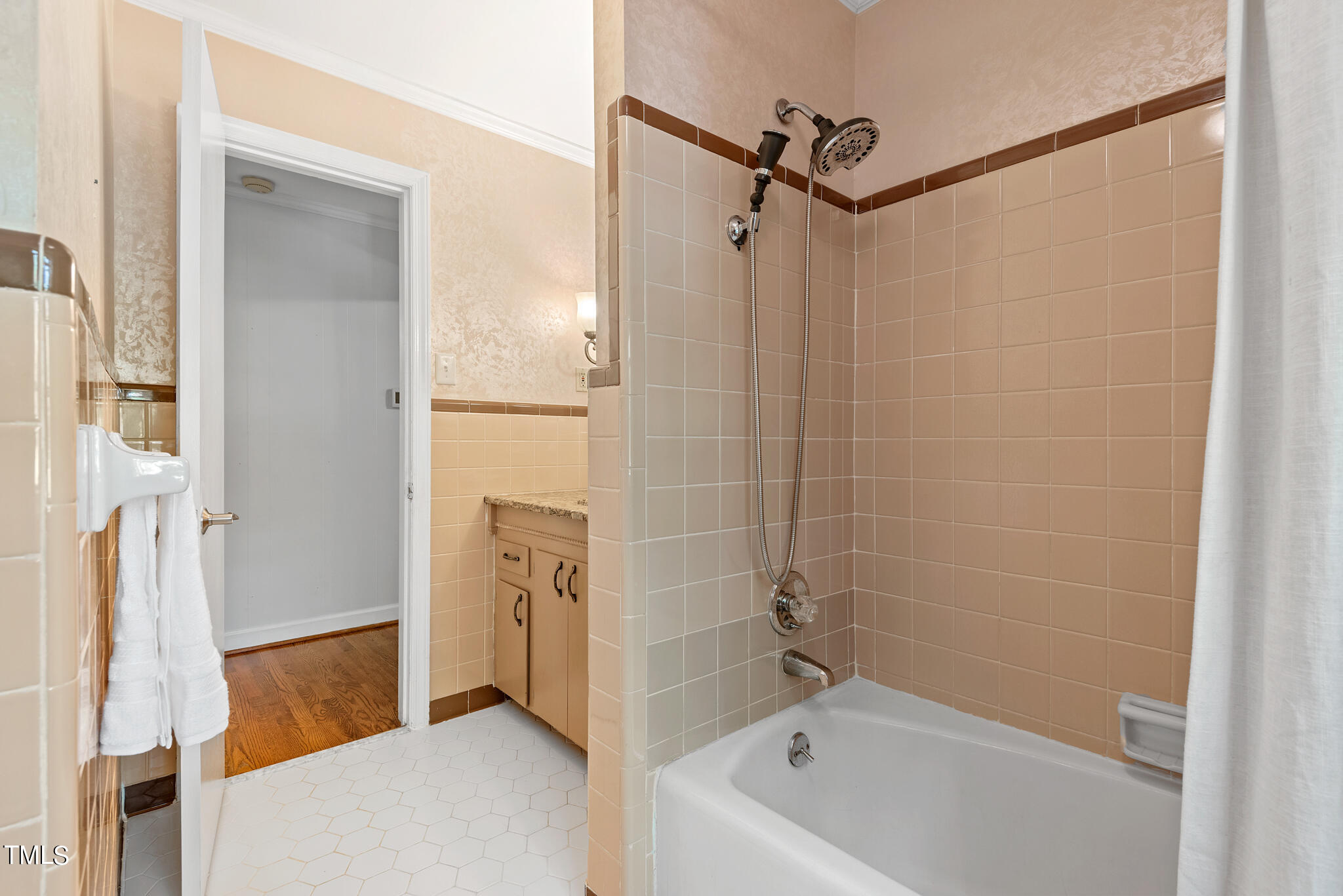 3404 Oates Drive Raleigh, NC 27604 - Photo 26 of 43 a bathroom with a tub a sink and a shower