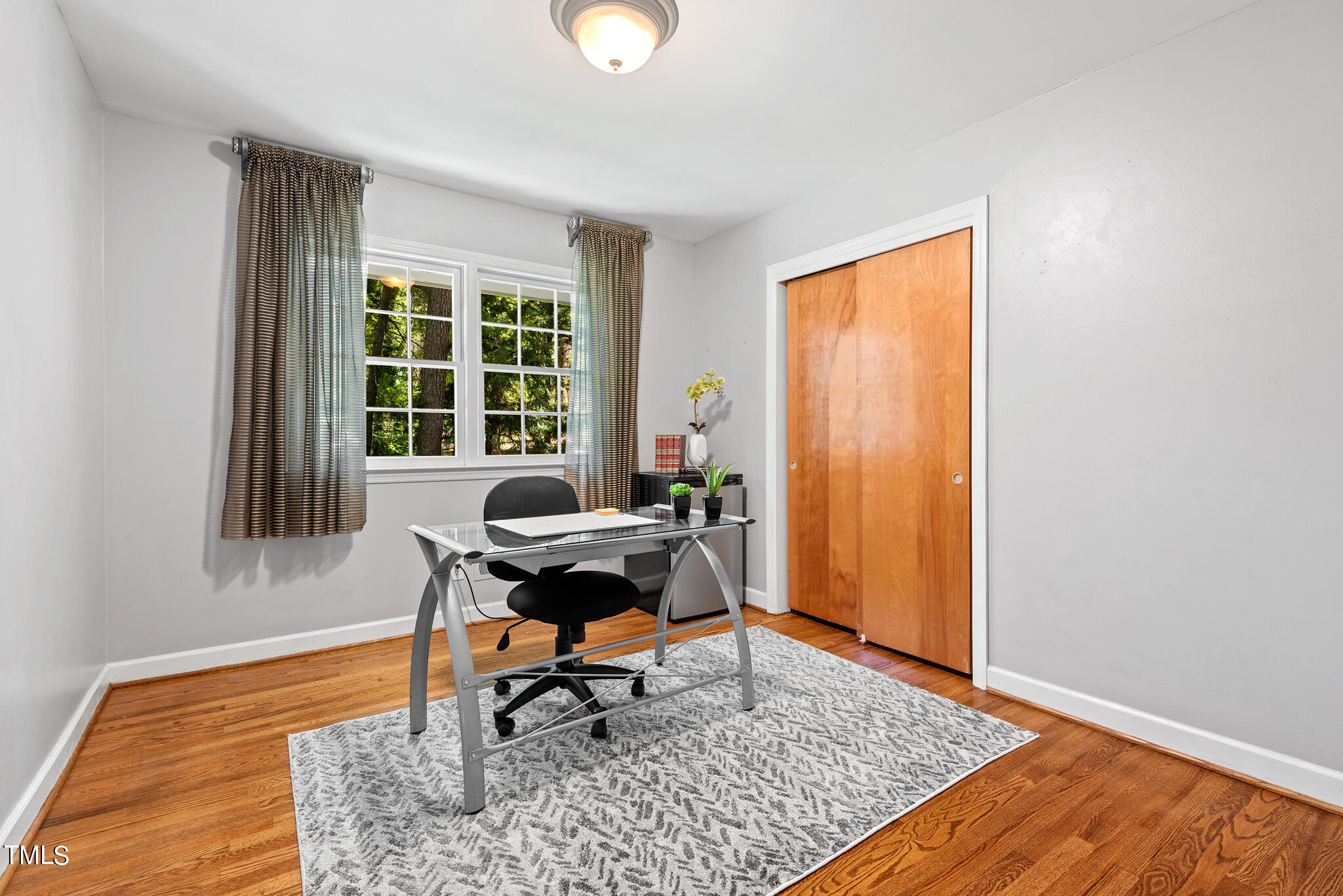 3404 Oates Drive Raleigh, NC 27604 - Photo 27 of 43 a workspace room with furniture rug and window