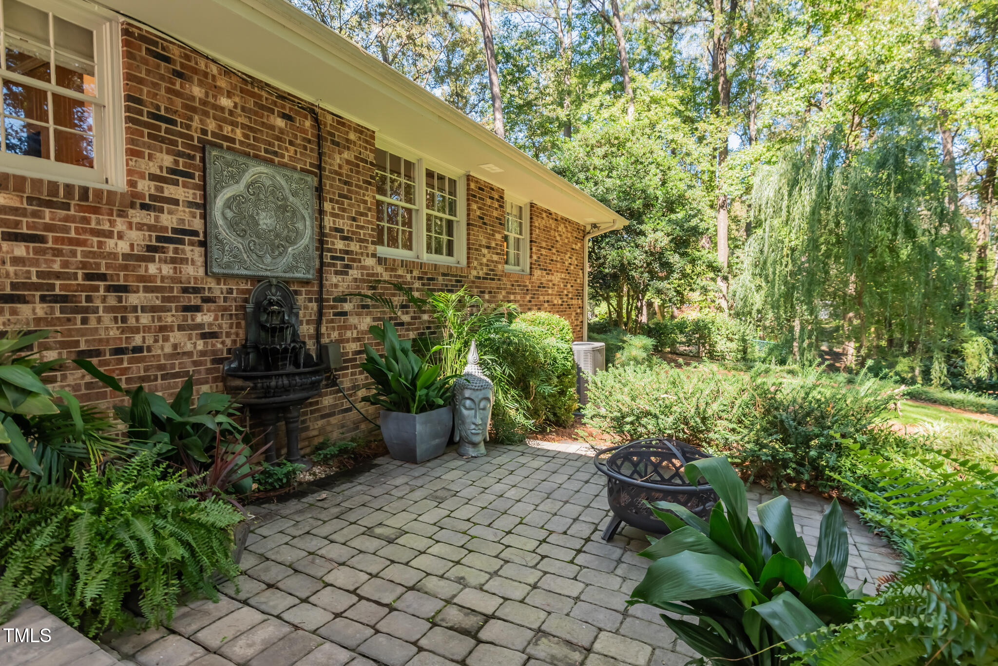 3404 Oates Drive Raleigh, NC 27604 - Photo 37 of 43 a backyard of a house with outdoor seating