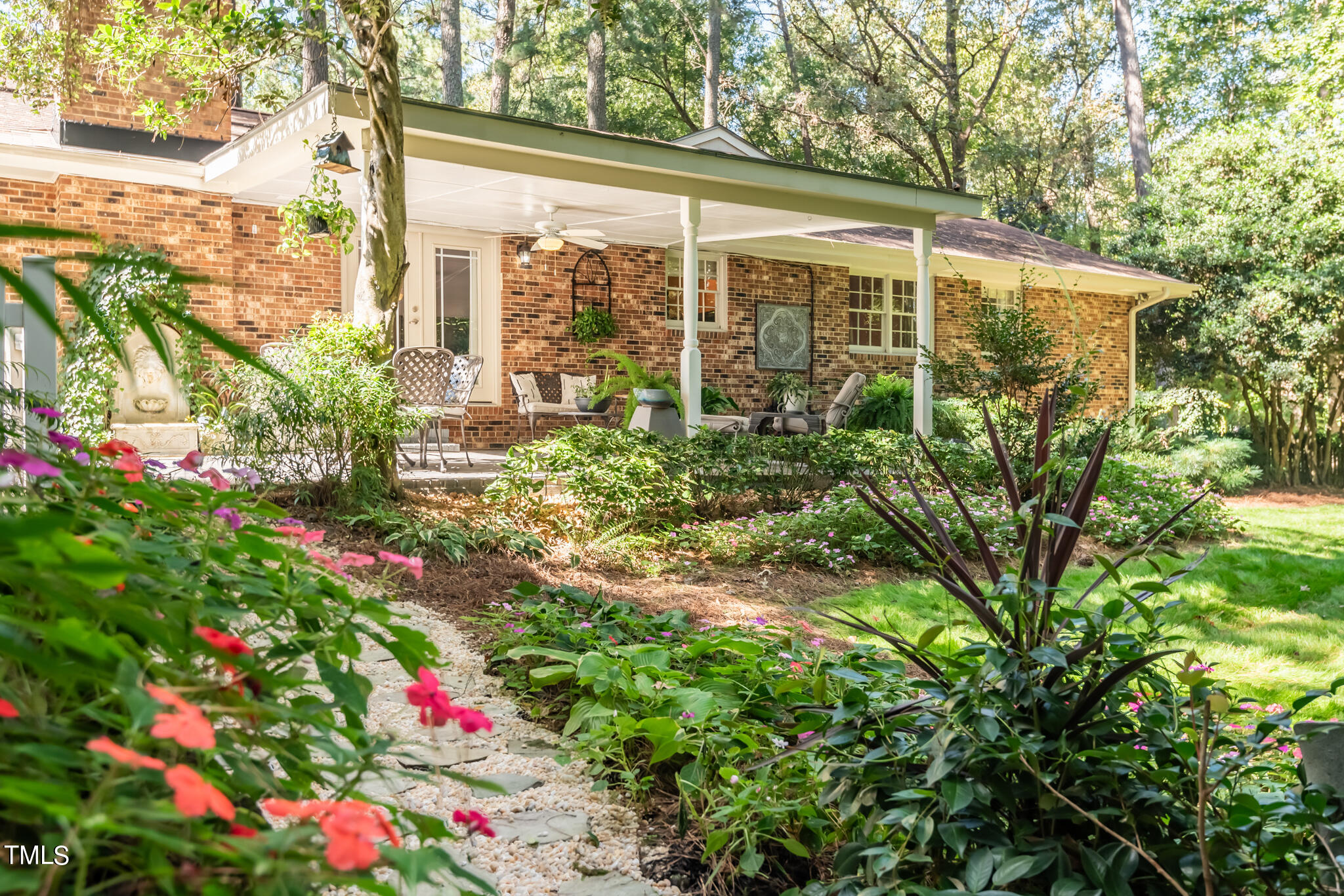 3404 Oates Drive Raleigh, NC 27604 - Photo 38 of 43 a small yard with fountain and flowers