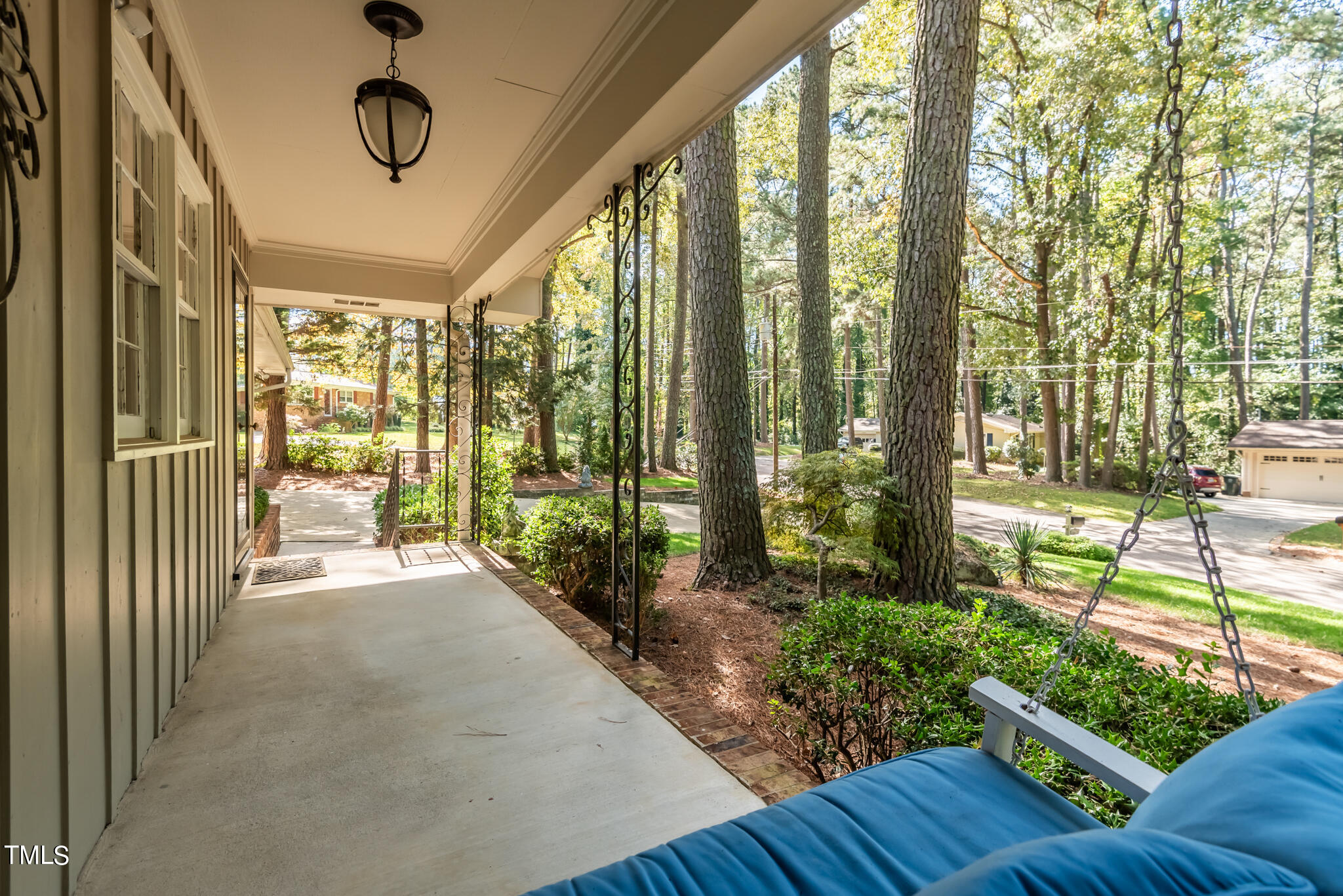 3404 Oates Drive Raleigh, NC 27604 - Photo 6 of 43 a view of a porch with furniture and wooden floor