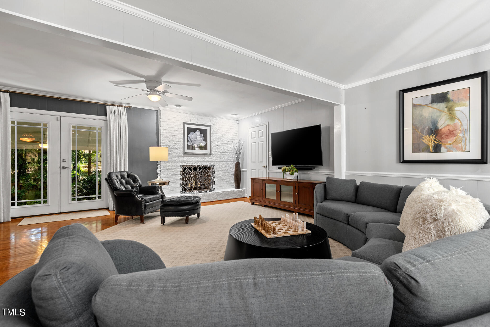 3404 Oates Drive Raleigh, NC 27604 - Photo 7 of 43 a living room with furniture and a flat screen tv